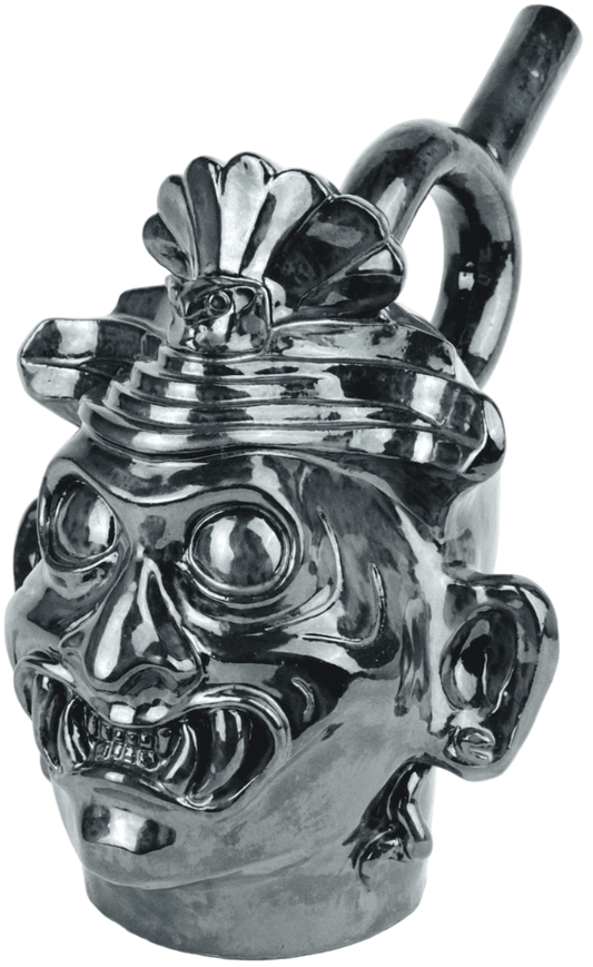 Metallic skull-shaped pipe on a white background