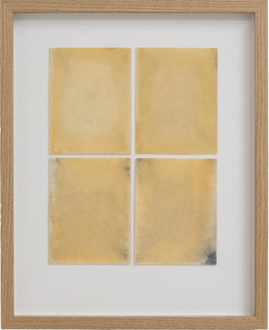 Framed artwork with four gold-colored rectangular panels on a white background