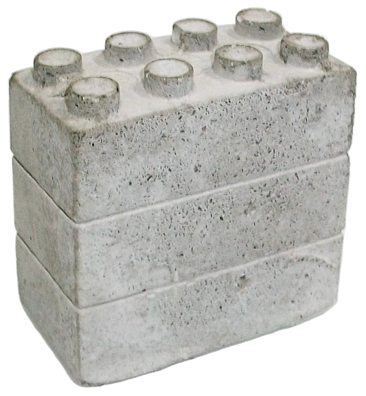 Concrete block with small concrete cylinders on a white background