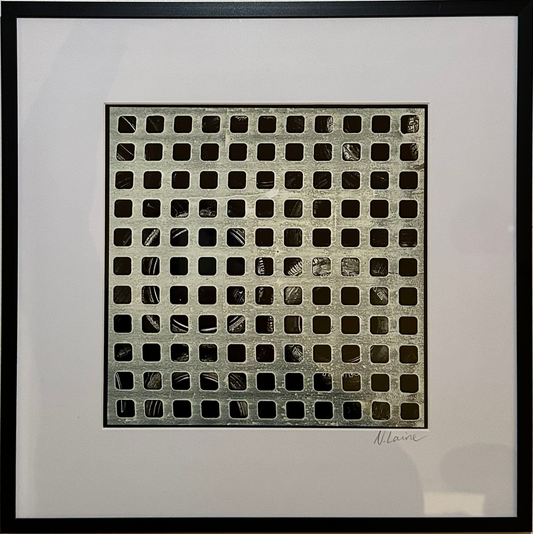 Framed black and white grid art on a beige wall