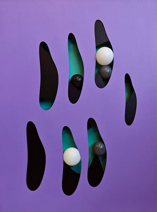 Mystical design with black and green shapes on a purple background