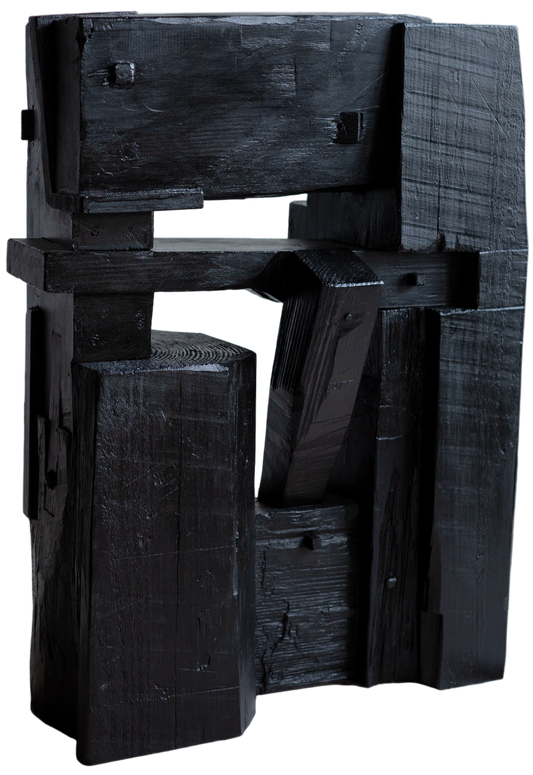 Black abstract sculpture on a light gray background