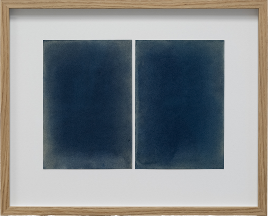 Framed artwork with two blue abstract panels on a white background