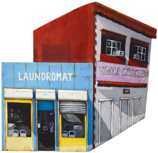 Wall-mounted sculpture of a laundromat and other buildings with text on a white background