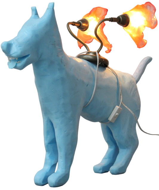 Blue dog-shaped lamp with a light bulb on a gray surface.
