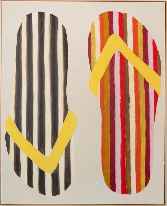 Abstract art piece with striped patterns on a white wall