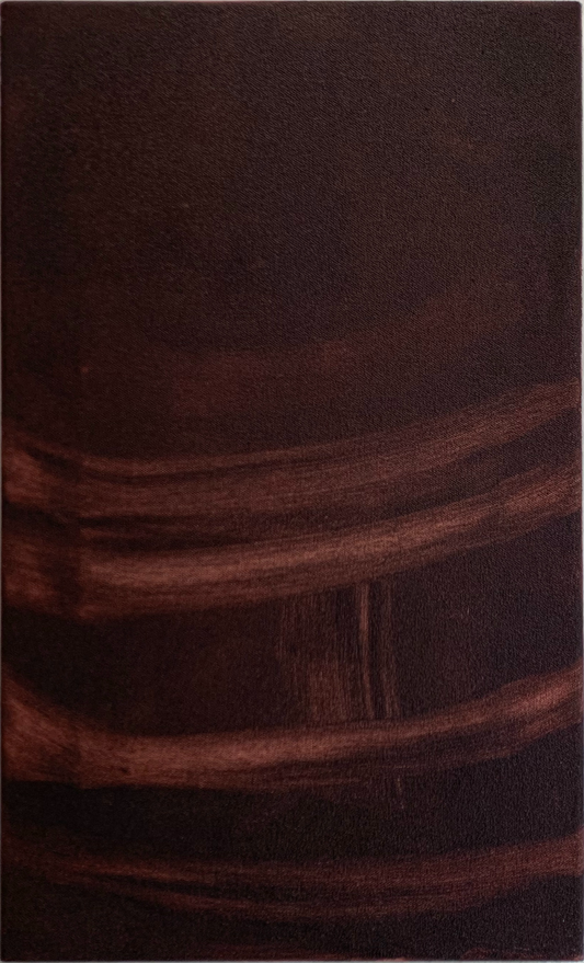 Brown textured fabric on a light wooden surface