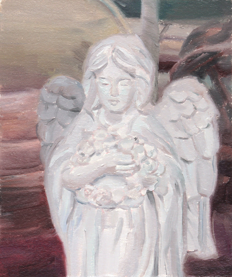 Angel statue in the window of a flower shop - image 1